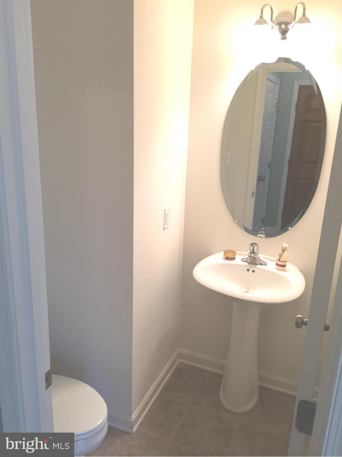 26 Riparian Lane Ranson, WV 25438 - Photo 26 of 28 a bathroom with a sink and a mirror