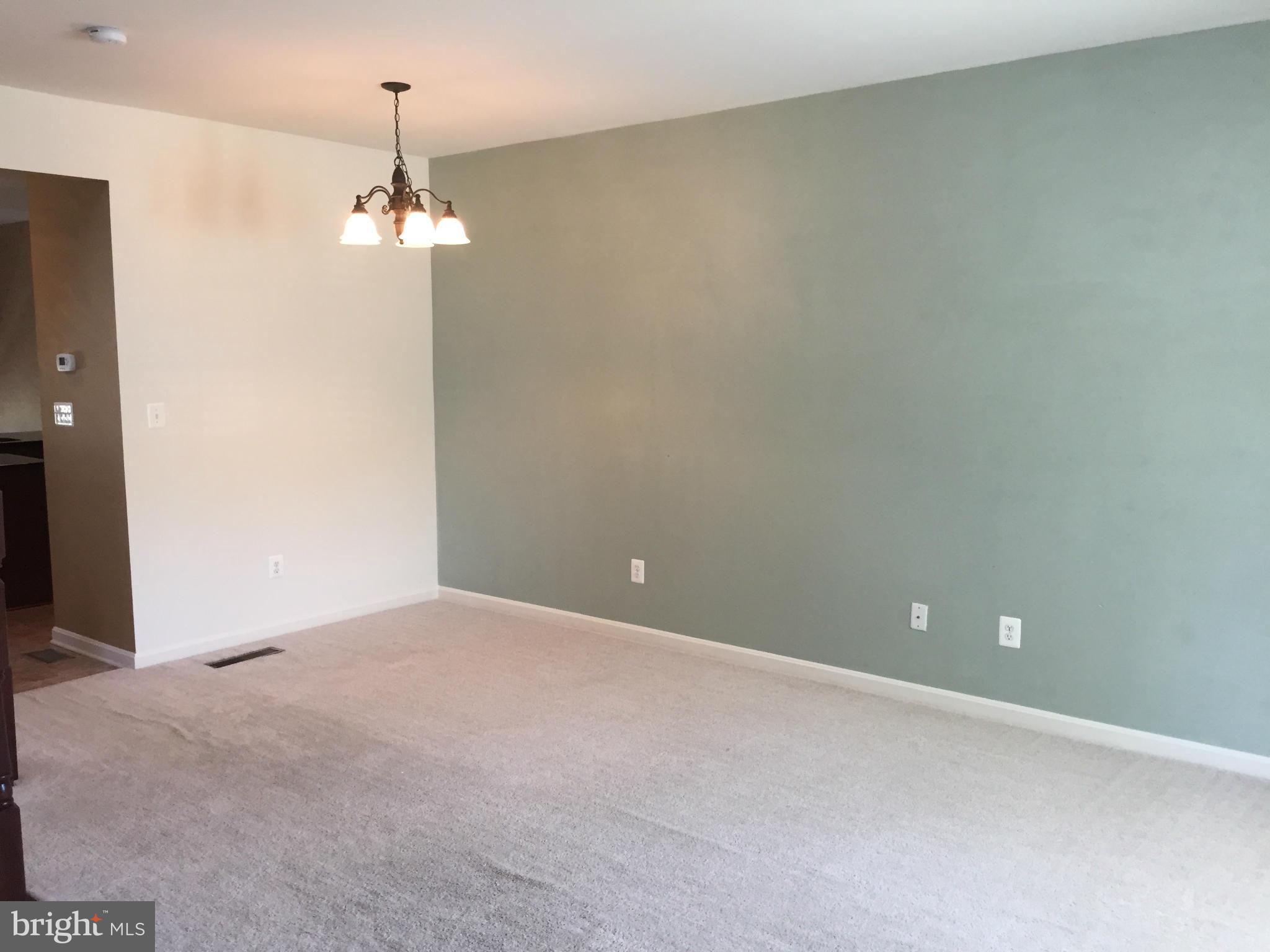 26 Riparian Lane Ranson, WV 25438 - Photo 8 of 28 a view of an empty room with a chandelier fan