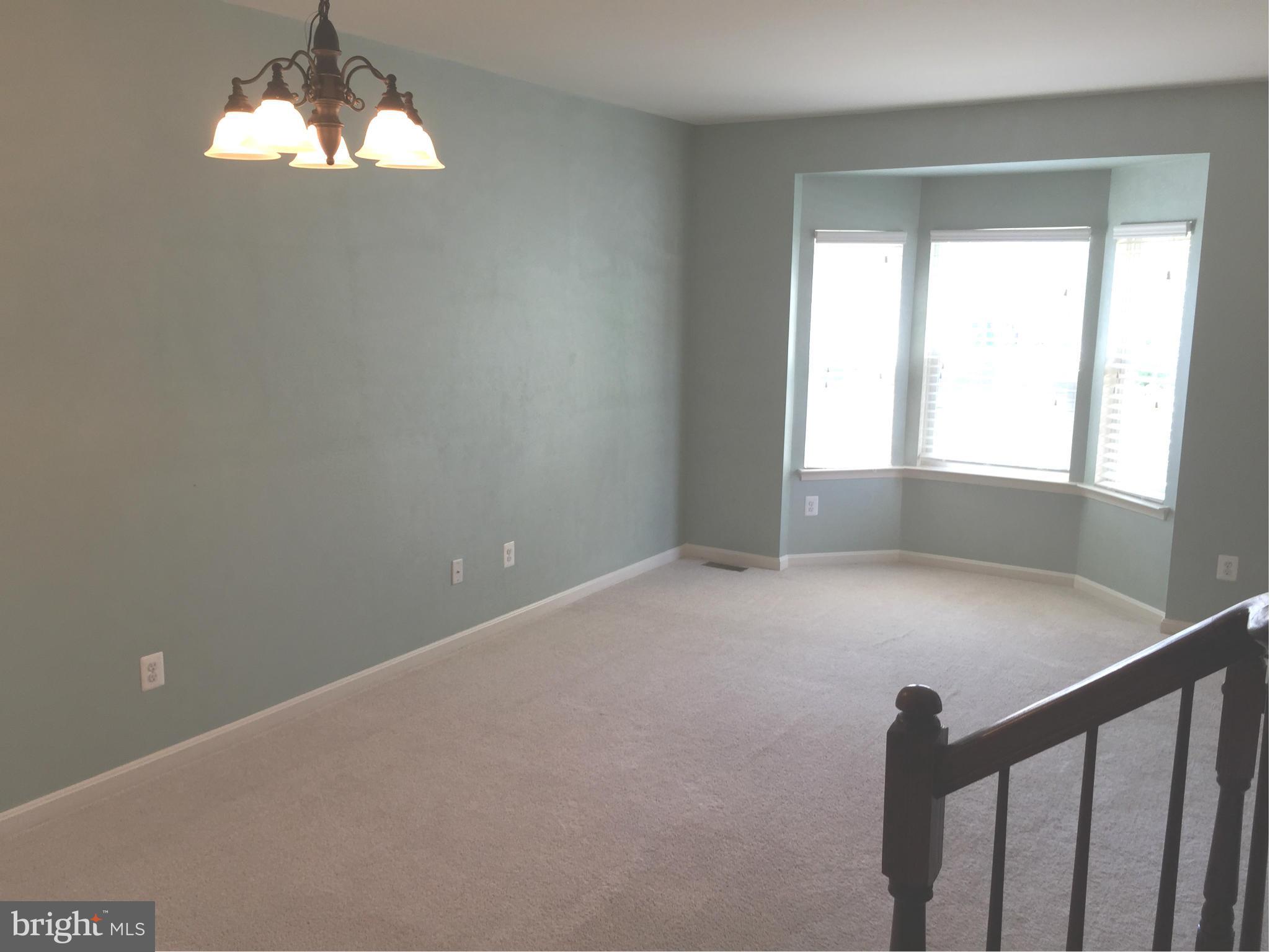 26 Riparian Lane Ranson, WV 25438 - Photo 9 of 28 a view of empty room with wooden floor and fan