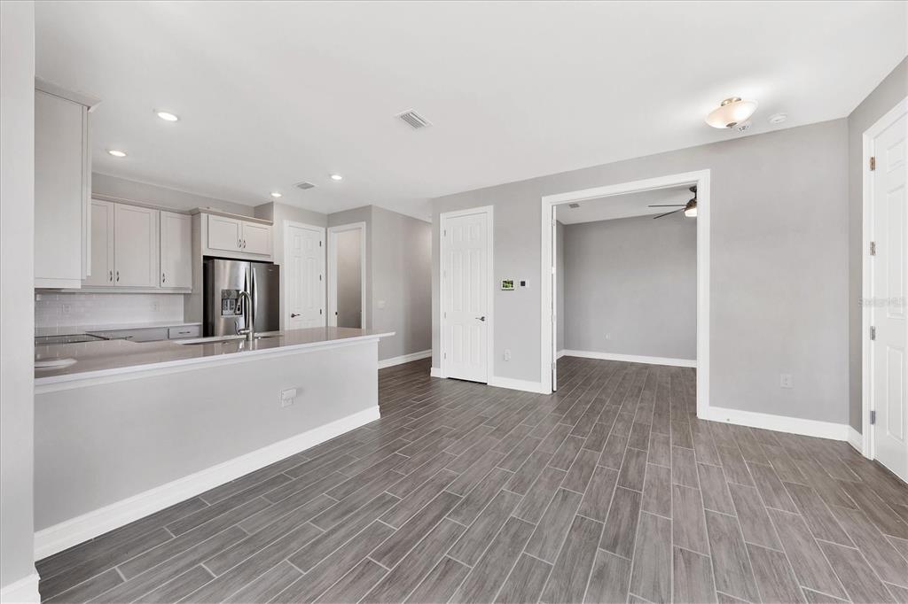 111 Ibiza Loop Venice, FL 34292 - Photo 11 of 37 a view of kitchen with wooden floor and electronic appliances
