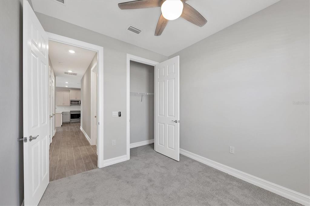 111 Ibiza Loop Venice, FL 34292 - Photo 23 of 37 an entryway and a chandelier fan in a room