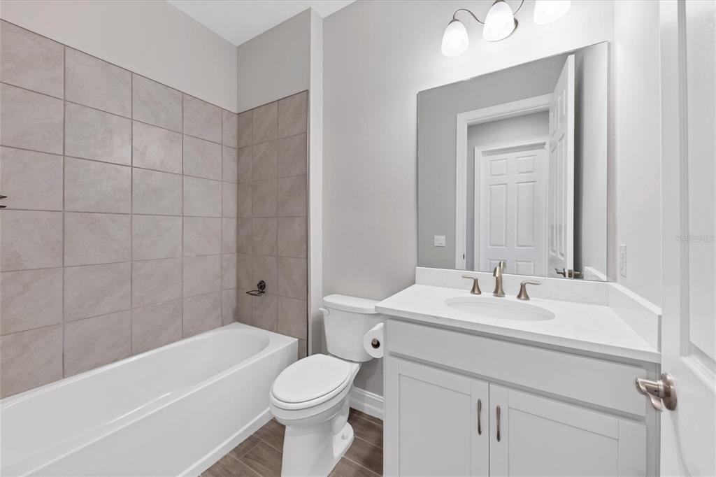 111 Ibiza Loop Venice, FL 34292 - Photo 25 of 37 a bathroom with a sink a toilet and shower