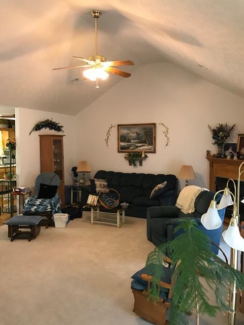 3623 Yager Road McMinnville, TN 37110 - Photo 12 of 16 a living room with furniture a chandelier and a fireplace