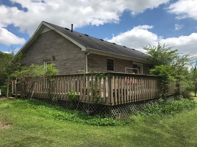 3623 Yager Road McMinnville, TN 37110 - Photo 3 of 16 a front view of a house with a garden