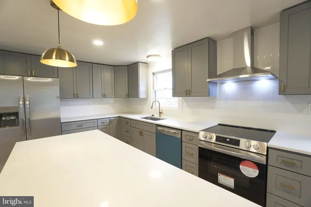 a kitchen with a stove and a sink
