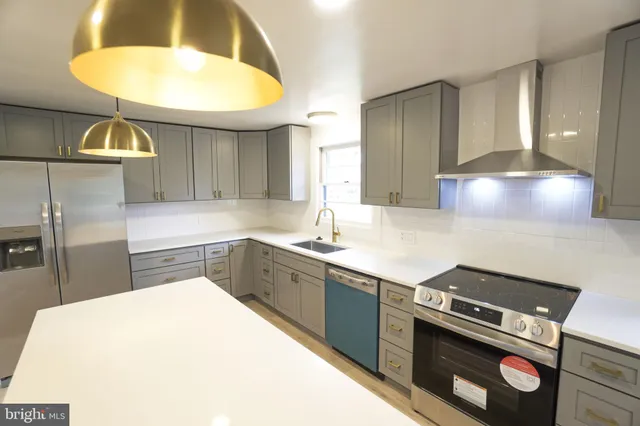 a kitchen with a stove and a sink