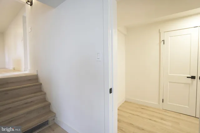 a view of an empty room with a fireplace