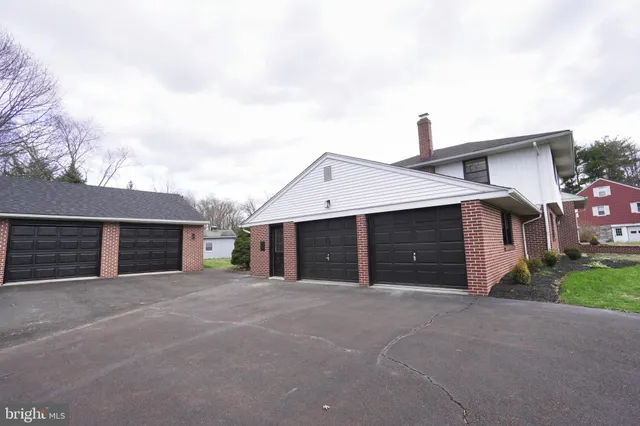 a view of a backyard with swimming pool