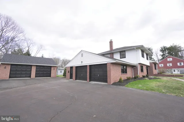 an aerial view of a house with a swimming pool