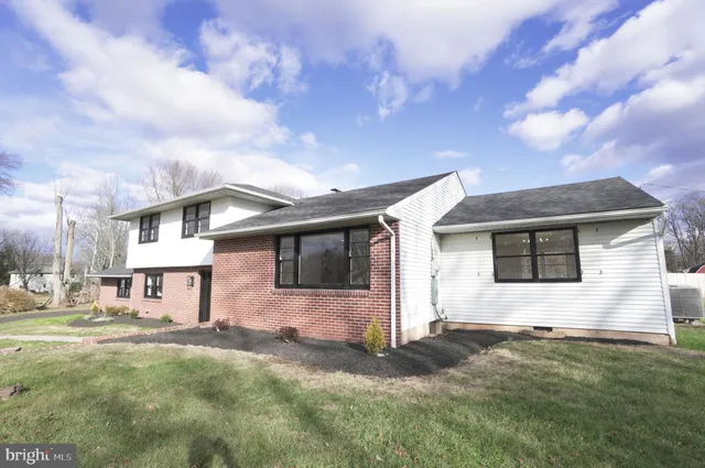 a view of a backyard of the house