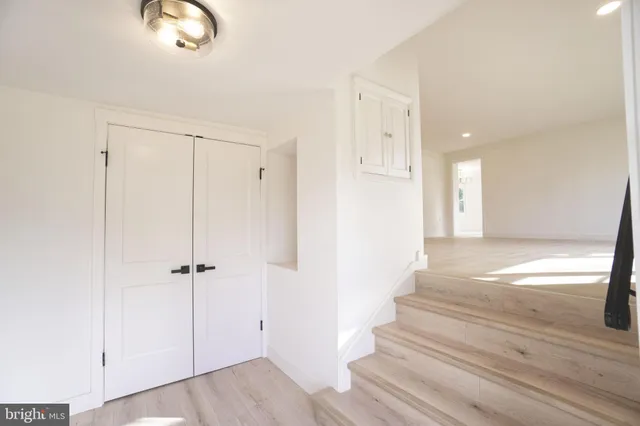 a view of an entryway with wooden floor
