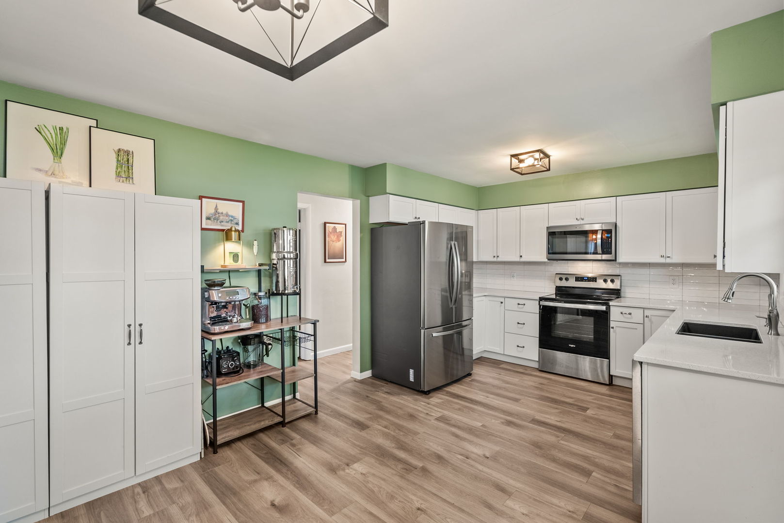 1435 26th Avenue Moline, IL 61265 - Photo 11 of 38 a kitchen with stainless steel appliances a refrigerator and a stove top oven