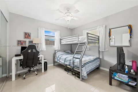 a bedroom with bed and a window