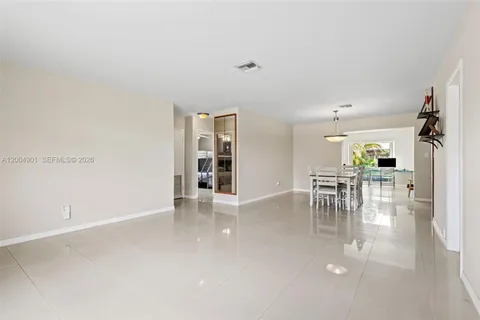 an empty room with furniture and view