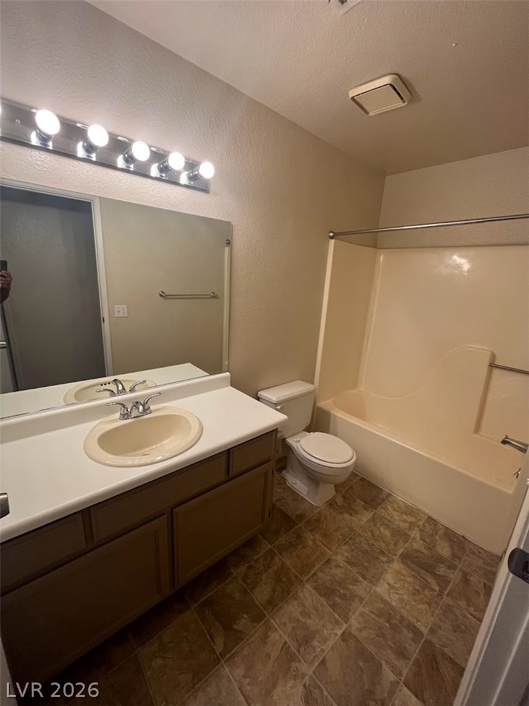 914 Scarlet Ridge Drive Las Vegas, NV 89128 - Photo 17 of 25 Functional full bathroom with vanity mirror, sink, and an integrated tub and shower unit.