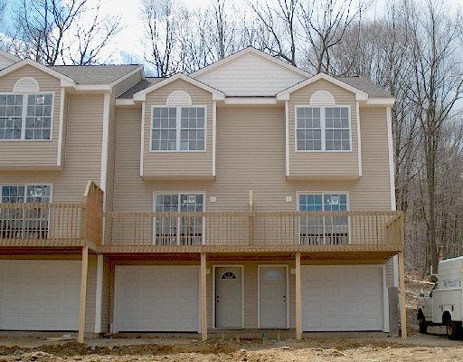 10 Trolley Bridge Road, Unit 10 Shelton, CT 06484 - Photo 1 of 1 a front view of a house with large windows