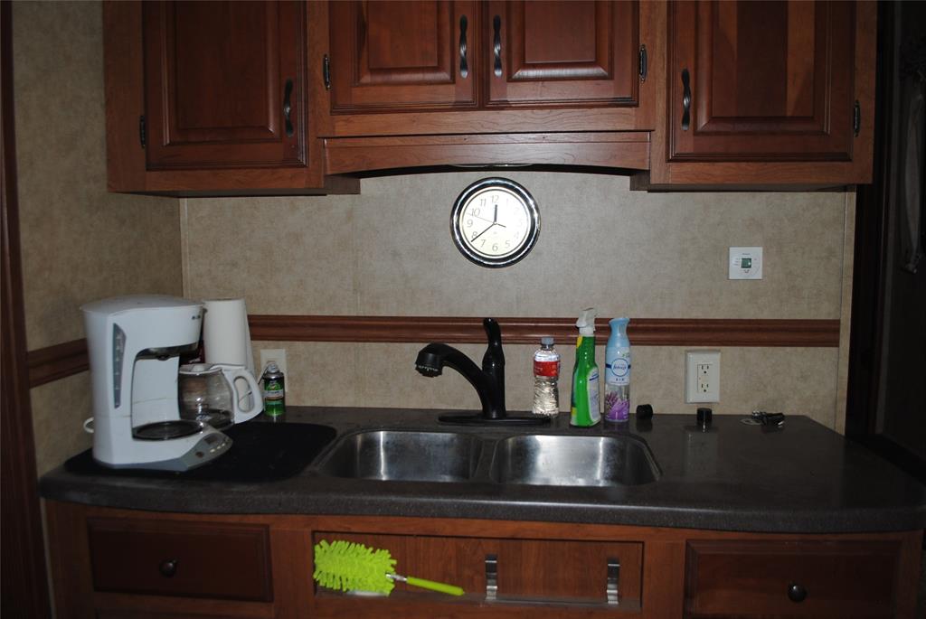 23 Promontory Port Comanche, TX 76442 - Photo 12 of 23 a kitchen with a sink and cabinets