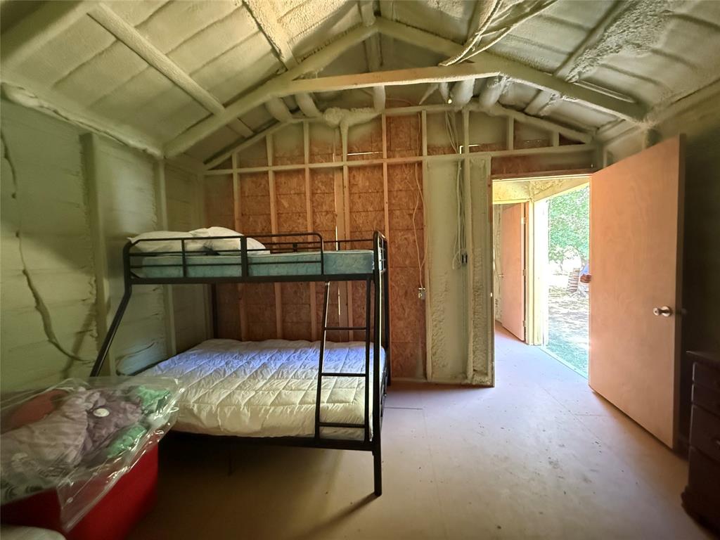 23 Promontory Port Comanche, TX 76442 - Photo 16 of 23 a bedroom with a bed and a shower