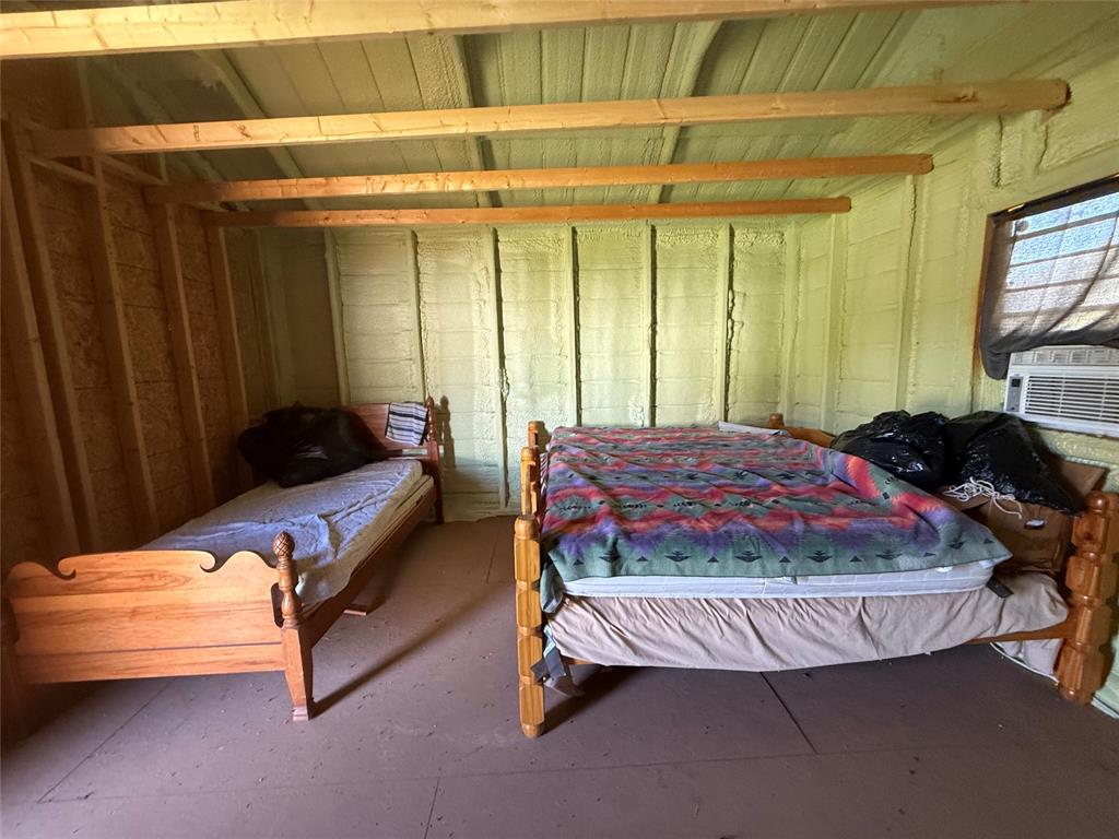 23 Promontory Port Comanche, TX 76442 - Photo 17 of 23 a bed sitting in a room next to a window