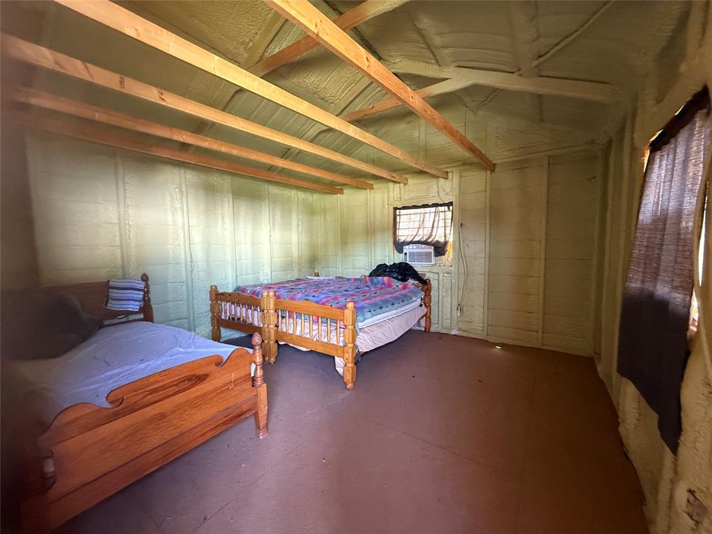 23 Promontory Port Comanche, TX 76442 - Photo 18 of 23 a bedroom with furniture and a large window