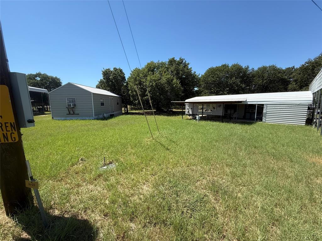 23 Promontory Port Comanche, TX 76442 - Photo 21 of 23 a view of a backyard with plants and a patio