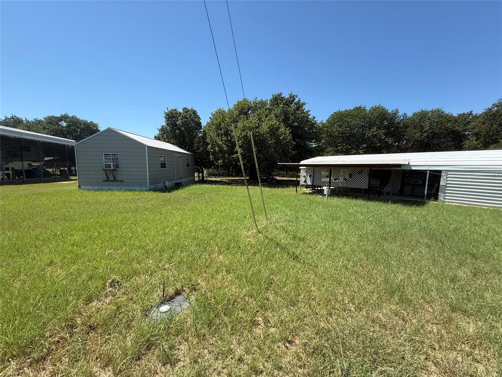 23 Promontory Port Comanche, TX 76442 - Photo 22 of 23 a view of a house with a yard