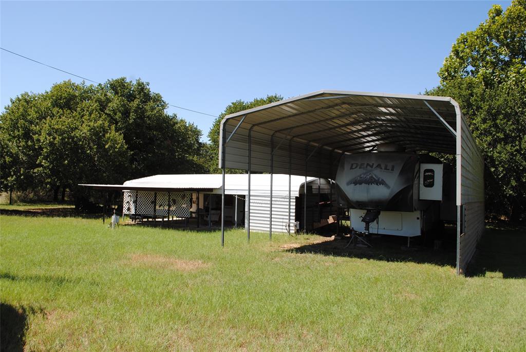 23 Promontory Port Comanche, TX 76442 - Photo 3 of 23 a view of a house with backyard and sitting area