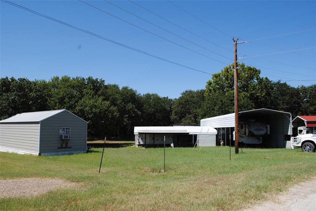 23 Promontory Port Comanche, TX 76442 - Photo 4 of 23 a backyard of a house with table and chairs