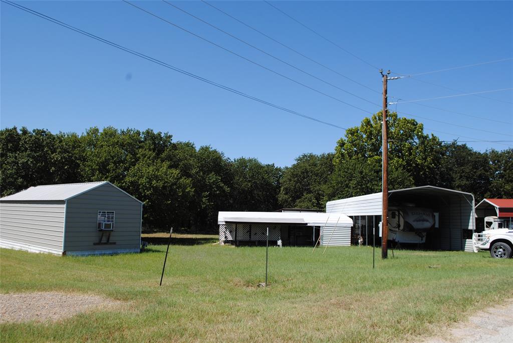 23 Promontory Port Comanche, TX 76442 - Photo 5 of 23 a backyard of a house with table and chairs