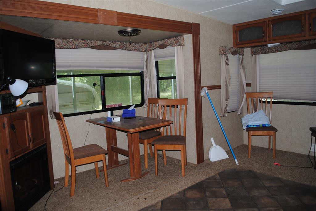 23 Promontory Port Comanche, TX 76442 - Photo 10 of 23 a view of a dining room with furniture window and wooden floor