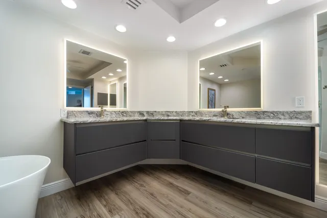 a spacious bedroom with a bed and a large window