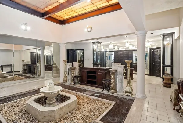 a living room with lots of furniture and a flat screen tv