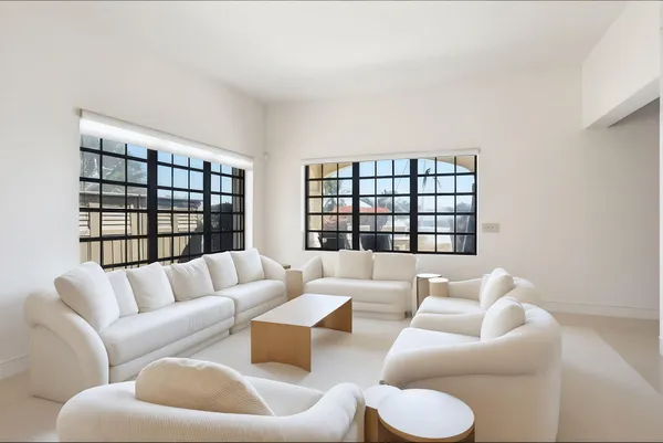 a view of a balcony with wooden floor and potted plants