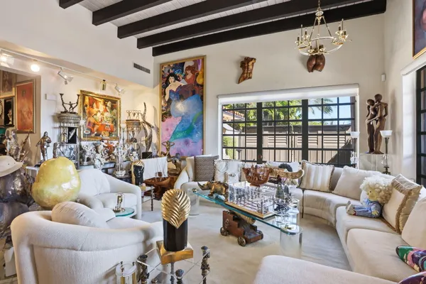 a bathroom with a toilet sink a mirror and vanity