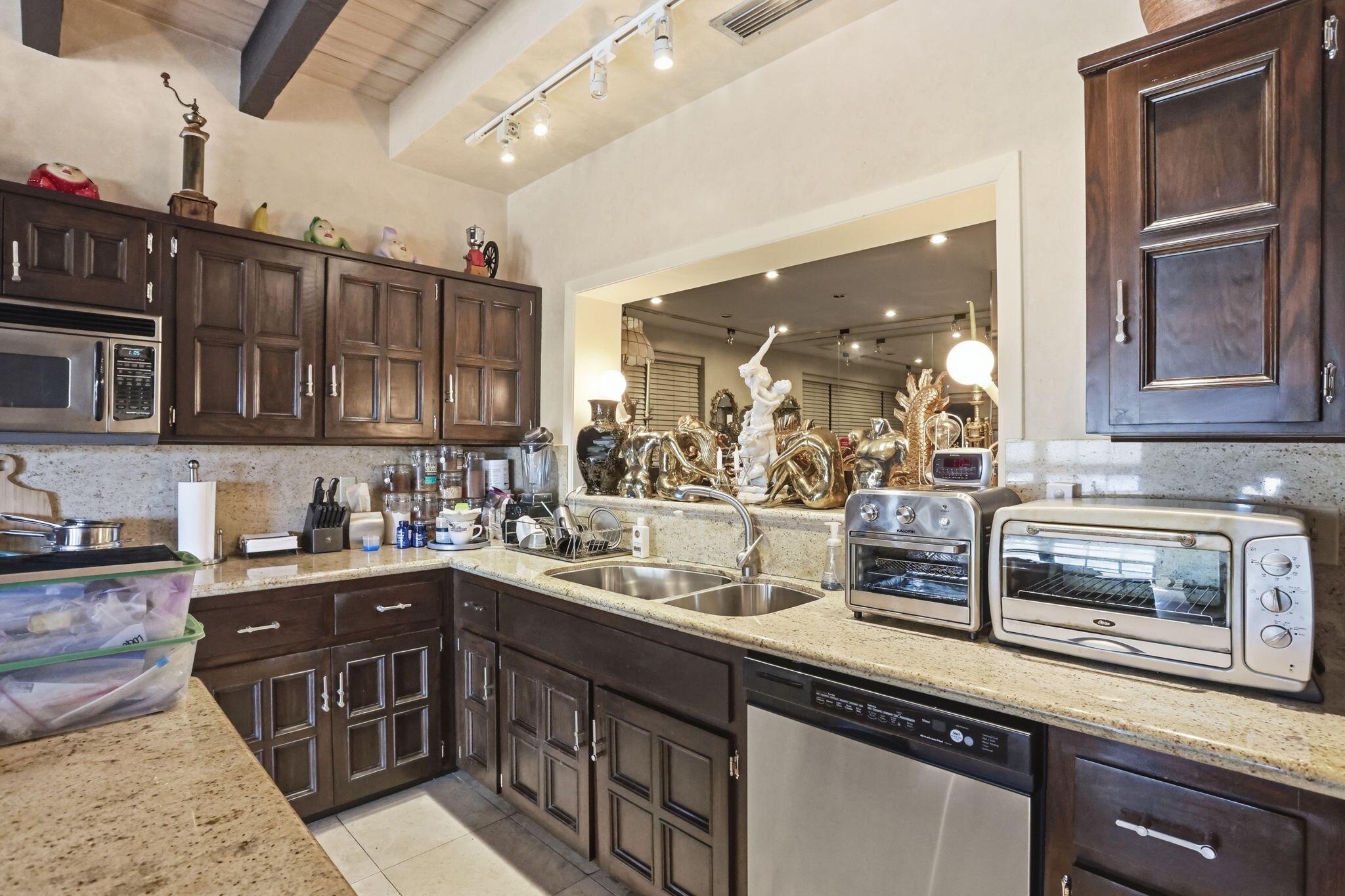2850 Northeast 44th Street Lighthouse Point, FL 33064 - Photo 25 of 67 a kitchen with a sink stove and microwave