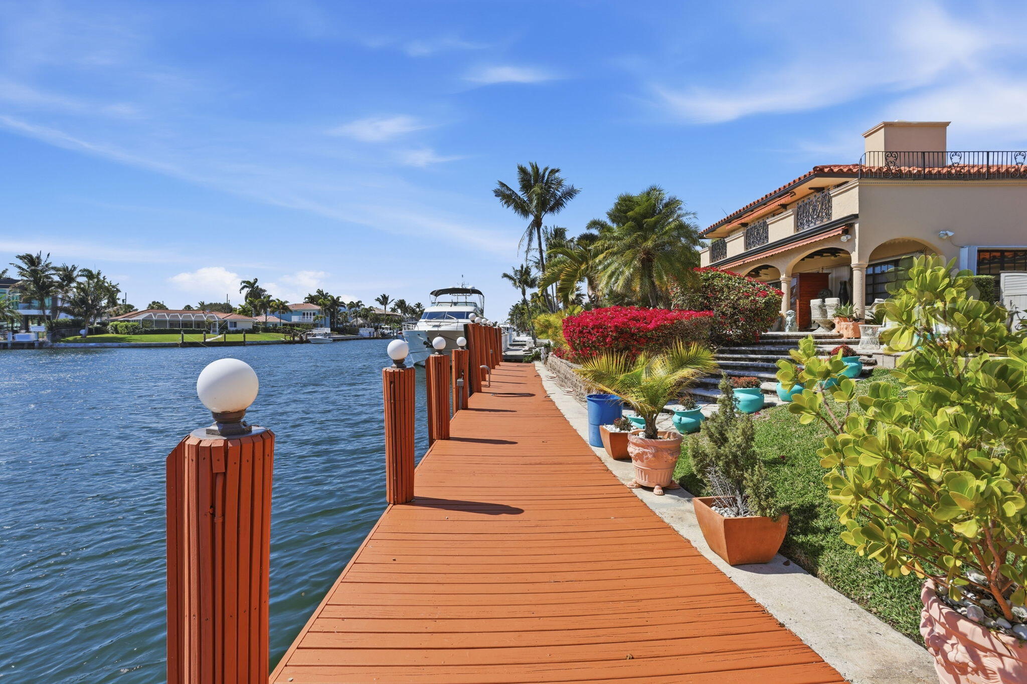 2850 Northeast 44th Street Lighthouse Point, FL 33064 - Photo 40 of 67 a view of a balcony with wooden floor and potted plants