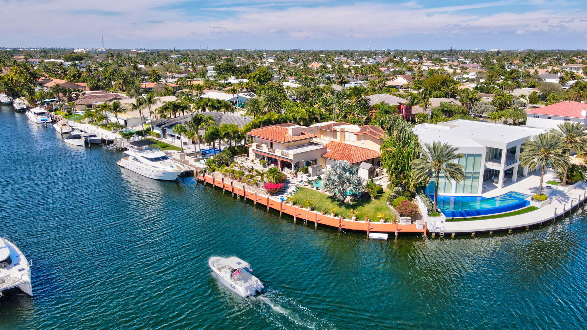 2850 Northeast 44th Street Lighthouse Point, FL 33064 - Photo 5 of 67 an aerial view of a house with outdoor space swimming pool and ocean view