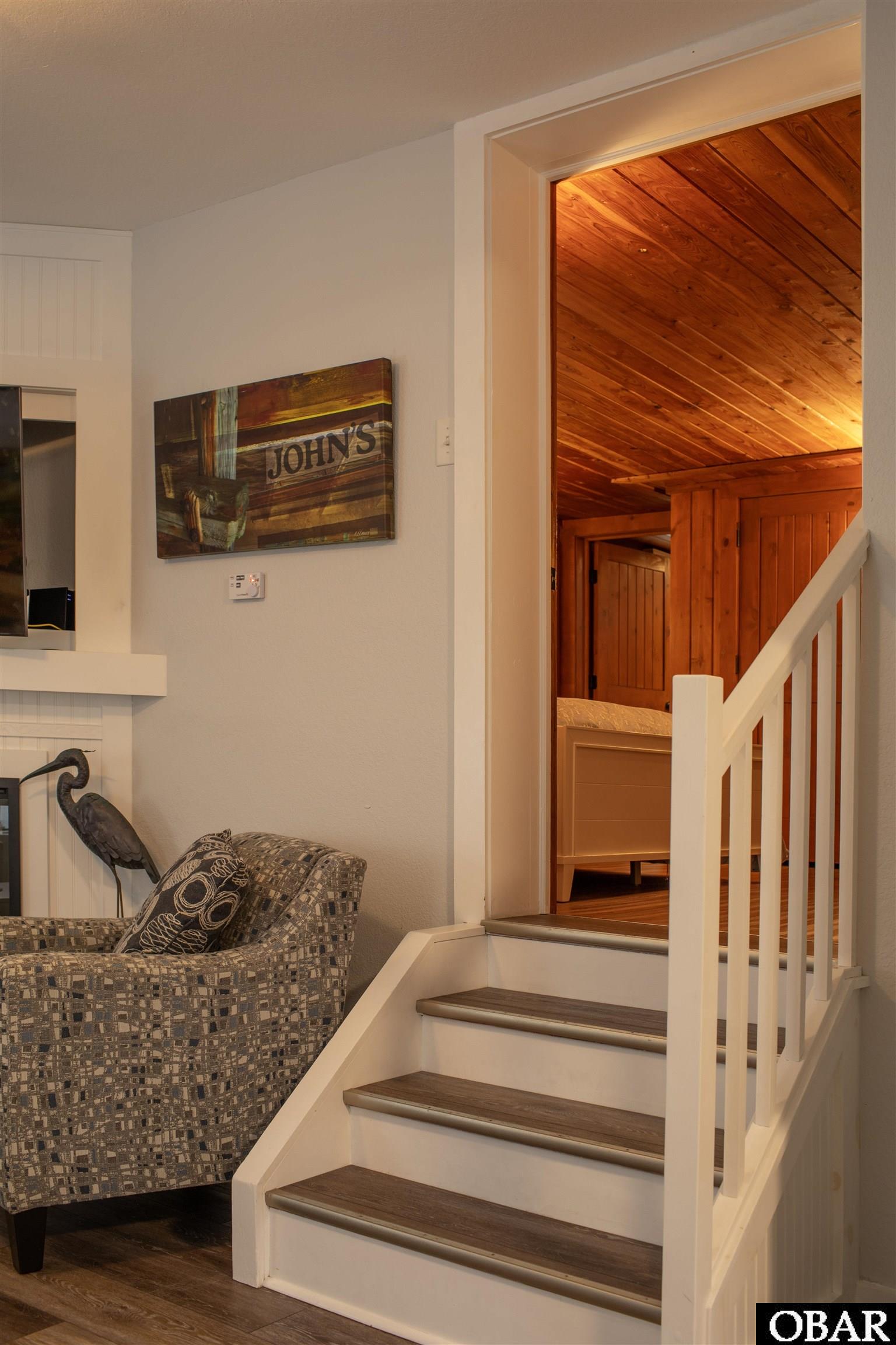 41 Skyline Road, Unit 1 Southern Shores, NC 27949 - Photo 50 of 58 Stairs from living room leading to queen-size bedr