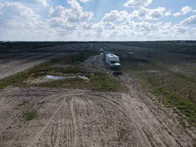 a view of a backyard of the house