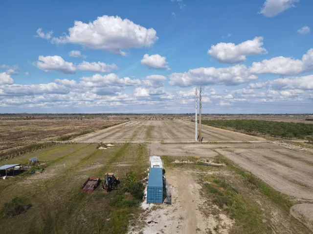 a view of a lake with a yard