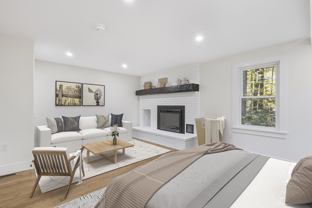 241 Prospect Street Franklin, MA 02038 - Photo 15 of 42 a living room with furniture and a fireplace