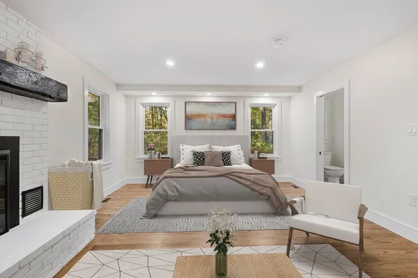 a spacious bedroom with a large bed and a couch