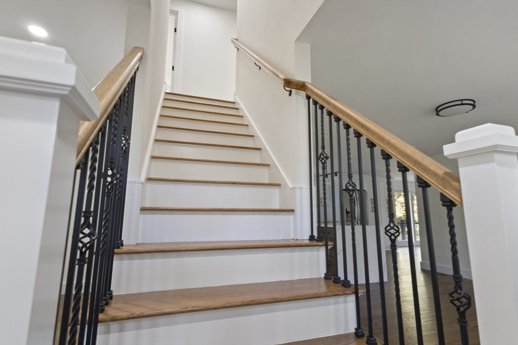 241 Prospect Street Franklin, MA 02038 - Photo 20 of 42 a view of staircase with wooden floor and white walls