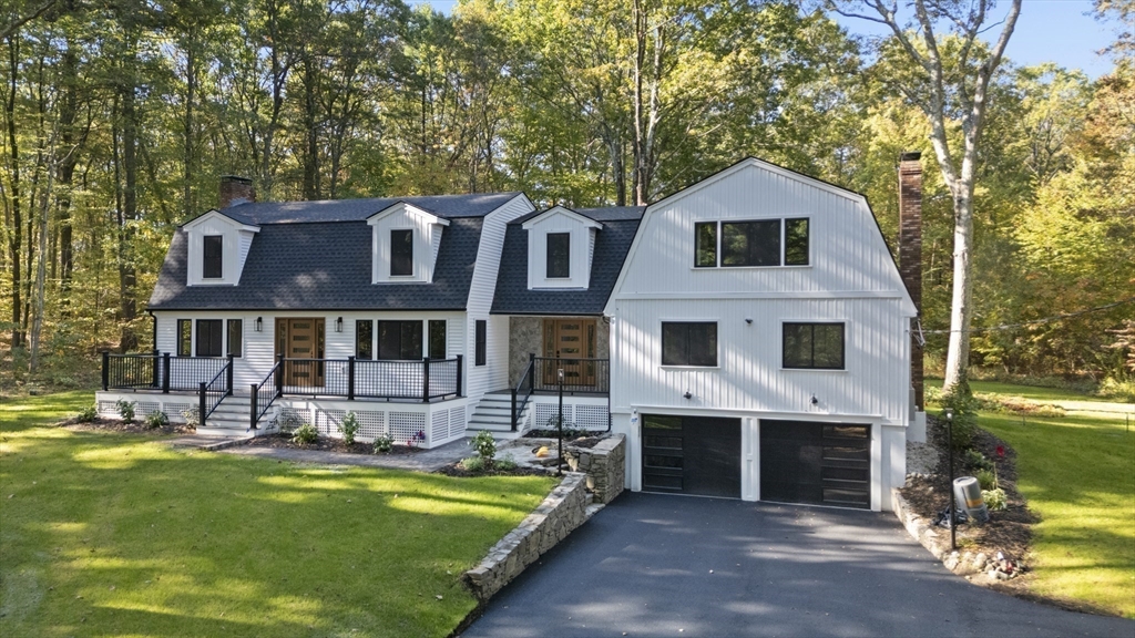 241 Prospect Street Franklin, MA 02038 - Photo 2 of 42 a front view of a house with swimming pool