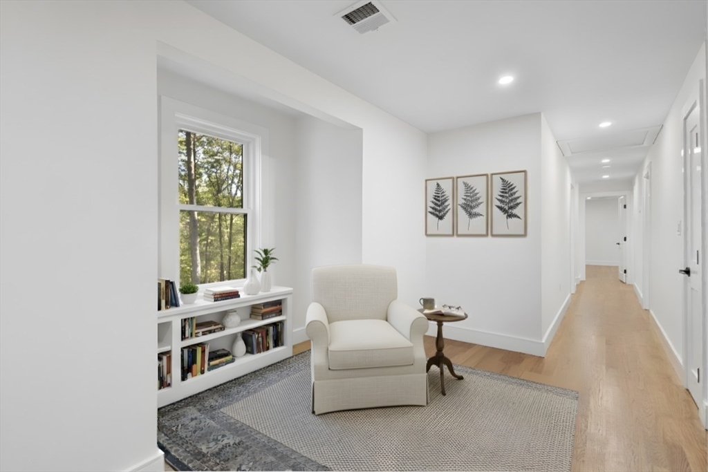 241 Prospect Street Franklin, MA 02038 - Photo 22 of 42 a living room with furniture a window and a potted plant
