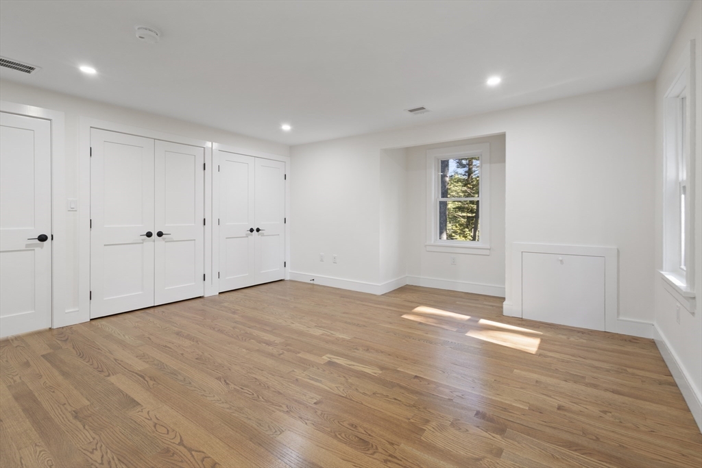 241 Prospect Street Franklin, MA 02038 - Photo 29 of 42 a view of an empty room with wooden floor and a window