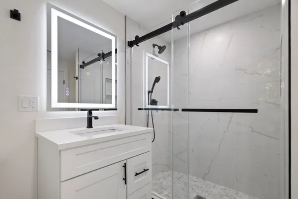 a bathroom with a sink and a mirror