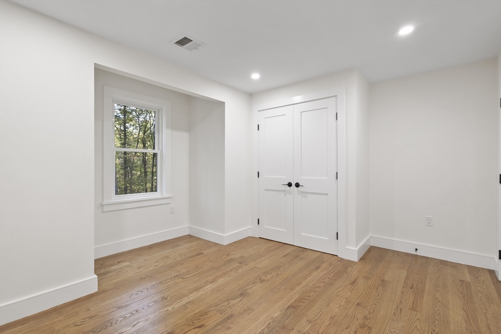 241 Prospect Street Franklin, MA 02038 - Photo 31 of 42 wooden floor in an empty room with a window