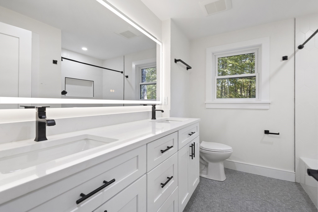 241 Prospect Street Franklin, MA 02038 - Photo 33 of 42 a bathroom with a toilet sink and mirror