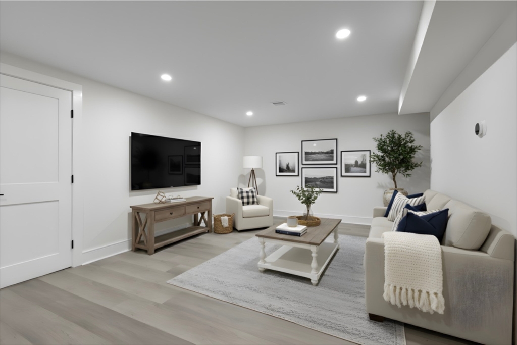 241 Prospect Street Franklin, MA 02038 - Photo 34 of 42 a living room with furniture and a flat screen tv
